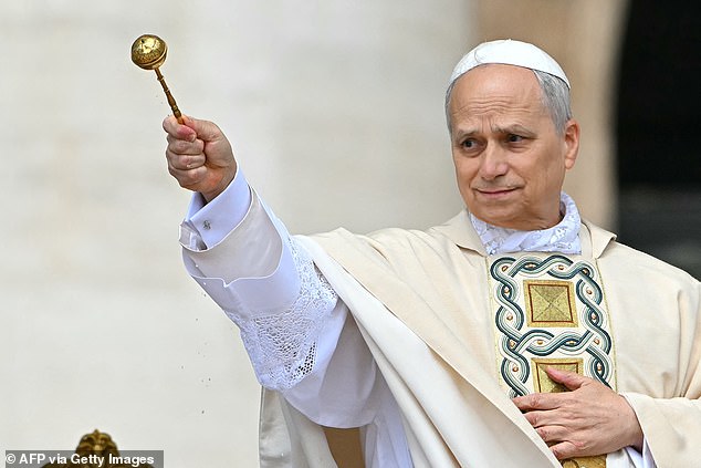 Pope Leo XIV sprinkles water as he blesses the faithful at a Holy Mass for the beginning of his pontificate