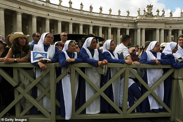 People and nuns gather in St.Peter's Square for Pope Leo XIV's inauguration mass