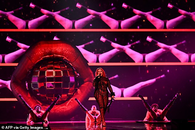 The 24-year-old took to the stage to take part in the second semi-final and the crowd went wild as she sung her tune Serving in a black and red leopard print jumpsuit