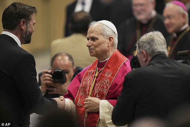 The US Pontiff, 69, warmly took hold of Vance's hand as he received a series of world leaders at St Peter's Square