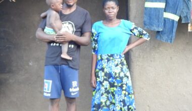 About 8,800 villagers around Chikwawa in Malawi are receiving the equivalent of £433 each ¿ and the Foreign Office insists the best way to send the money is directly to each of them (Pictured: Essau Harold outside his house with his new wife he married after receiving the funds)