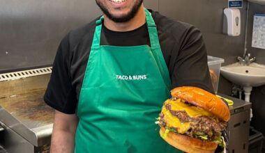 Takeaway owner Karym Marida, 41, (pictured) holding a triple cheeseburger at his zero-rated Taco and Buns store in Leyton, east London