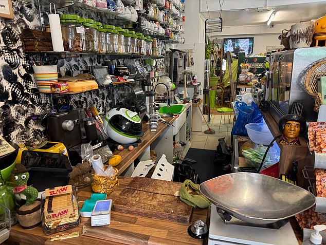 When MailOnline visited, the shop's kitchen had a knife left on the counter beside food and a plunger
