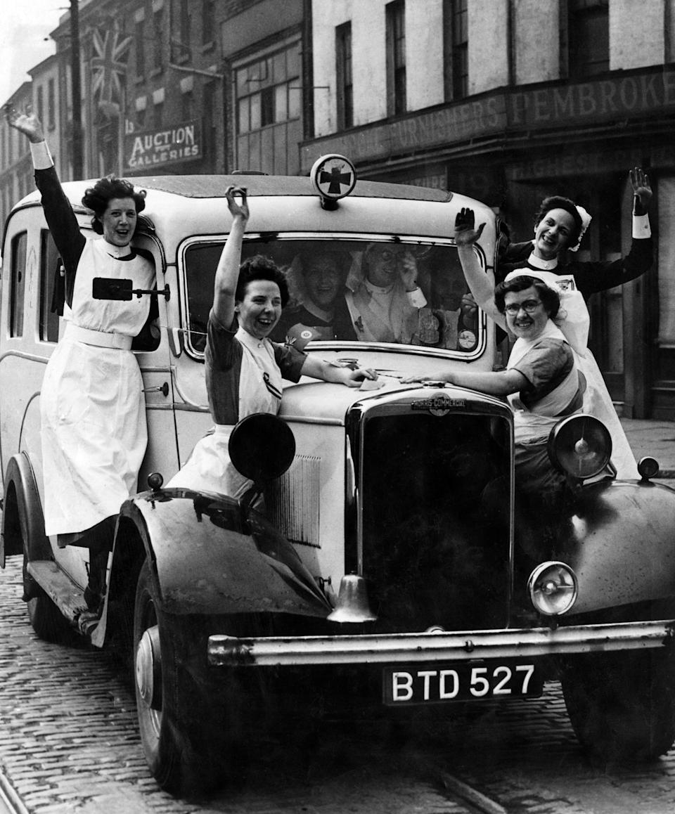 Jubilant nurses celebrate VE-Day in Liverpool. 8th May 1945.
