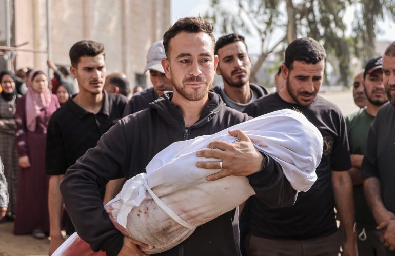 Relatives mourn the loss of loved ones killed in Israeli attack on a building of Palestinian Najjar family as bodies including children are brought to Indonesian Hospital before burial in Jabalia File: Abdalhkem Abu Riash/Anadolu Agency