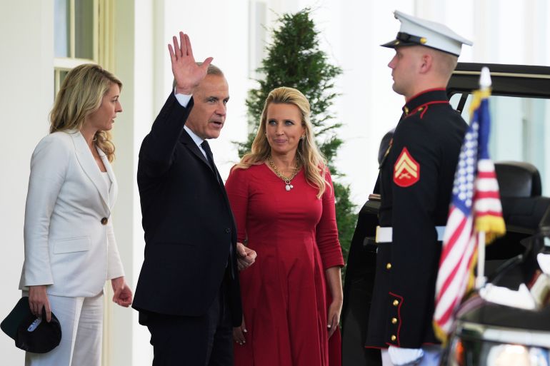 Mark Carney waves goodbye as he exits the White House