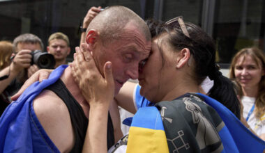 Ukrainian serviceman Vitaly kisses his wife, Olena, after returning from captivity during a POWs exchange between Russia and Ukraine, in Chernyhiv region, Ukraine, Sunday, May 25, 2025. (AP Photo/Efrem Lukatsky)