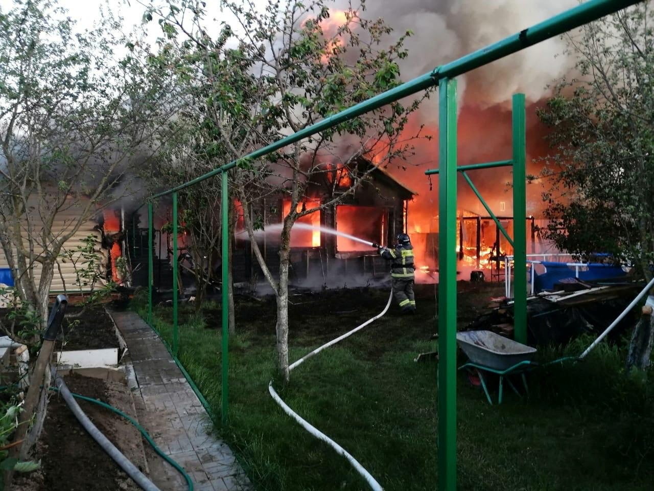 Firefighters put out a house fire caused by a drone strike near Moscow overnight
