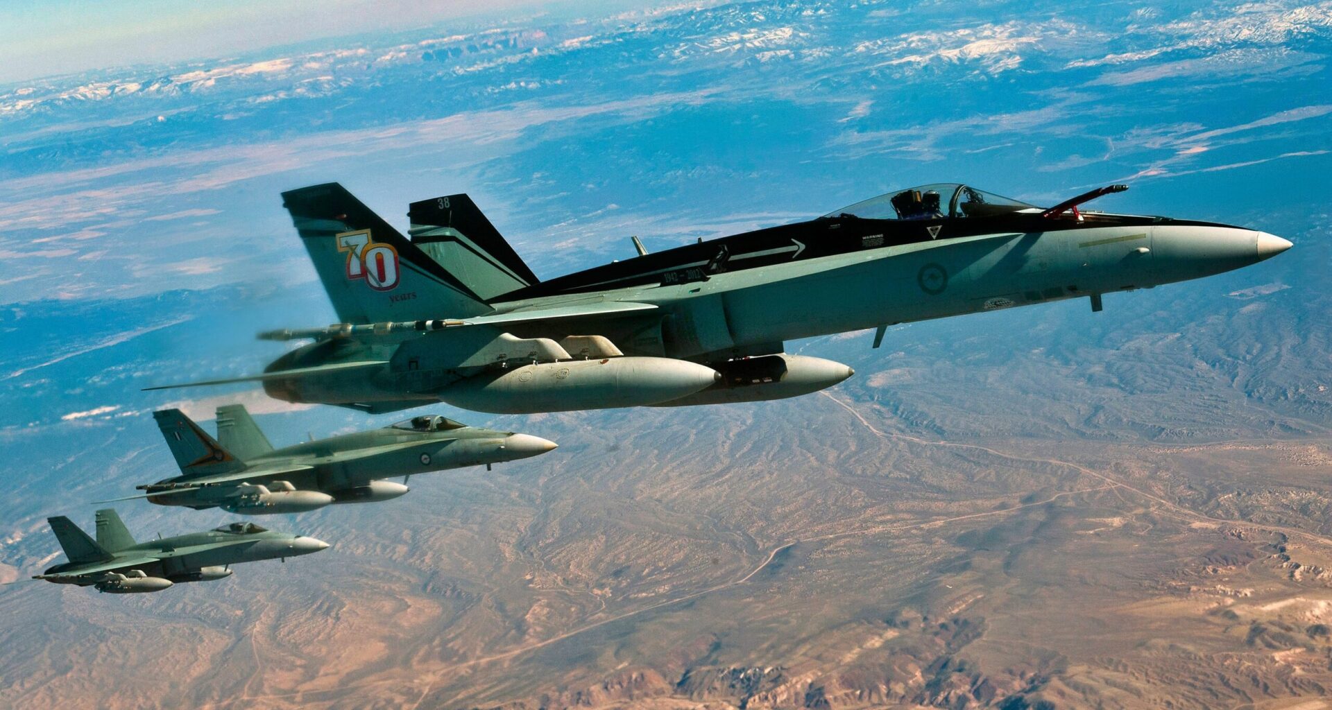 A three-ship of F/A-18 Hornets, Royal Australian Air Force, fly in a training mission during Red Flag 12-3 March 9, 2012, over the Nevada Test and Training Range. Members of the RAAF participate in the Red Flag exercise every other year. (U.S. Air Force photo by Senior Airman Brett Clashman)