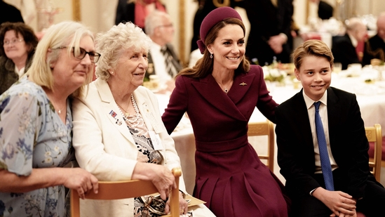 Britain's Catherine, Princess of Wales (2nd R) and Britain's Prince George of Wales (R) pose for pictures during a tea party for Second World War veterans at Buckingham Palace on May 5, 2025 to celebrate the 80th anniversary of VE Day also known as Victory in Europe Day, marking the end of the Second World War in Europe. (AFP)