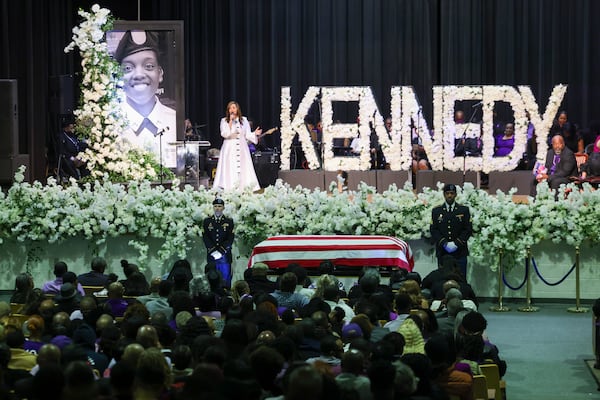 Nikki Davis sings during the funeral for Army Reservist Sgt. Kennedy L. Sanders at the auditorium at Ware County Middle School on Feb. 17, 2024, in Waycross. Sanders was killed in a drone attack on Jan. 28 in Jordan. (Jason Getz/AJC 2024)