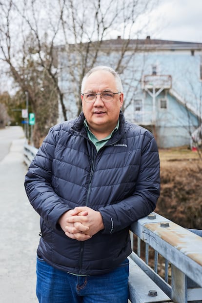 Jody Stone, Stanstead mayor, next to the Tomifobia River, which forms part of the border.