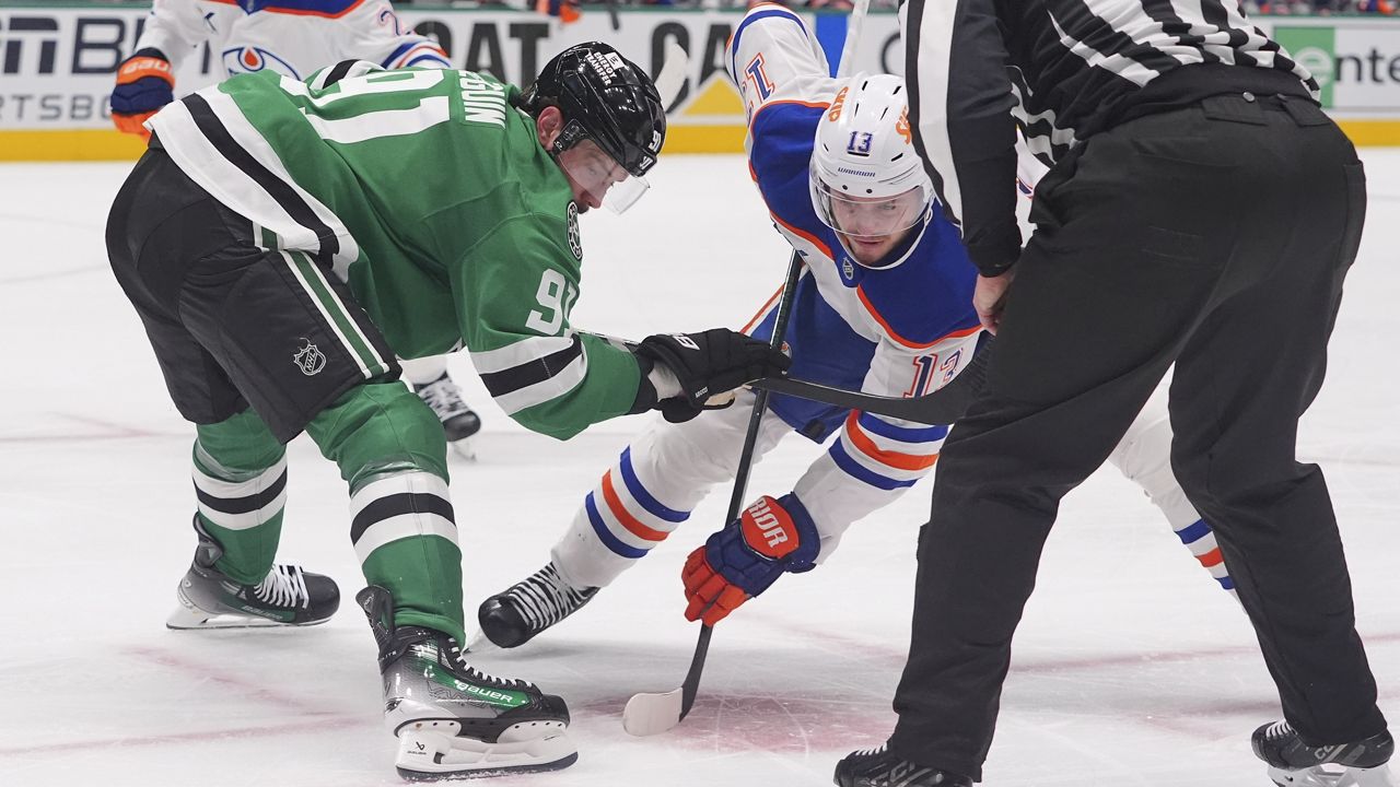 Dallas Stars center Tyler Seguin (91) and Edmonton Oilers center Mattias Janmark (13) face-off for the puck during the second period in Game 1 of the Western Conference finals in the NHL hockey Stanley Cup playoffs Wednesday, May 21, 2025, in Dallas. (AP Photo/LM Otero)
