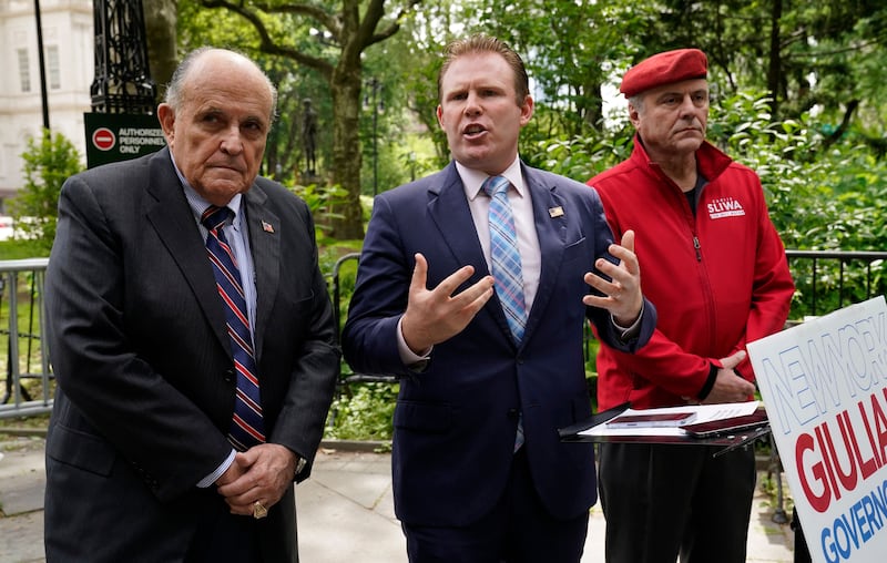 Former New York Mayor Rudy Giuliani campaigns with his son, Andrew, during his failed 2022 gubernatorial bid.