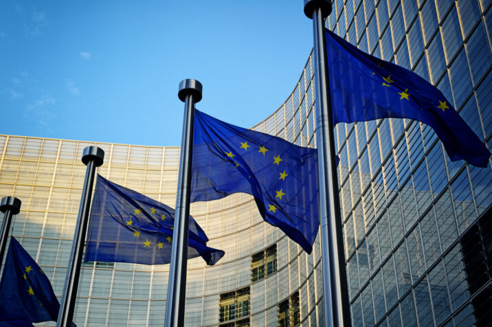 EU flags in front of European Commission EU flags in front of European Commission building in Brussels