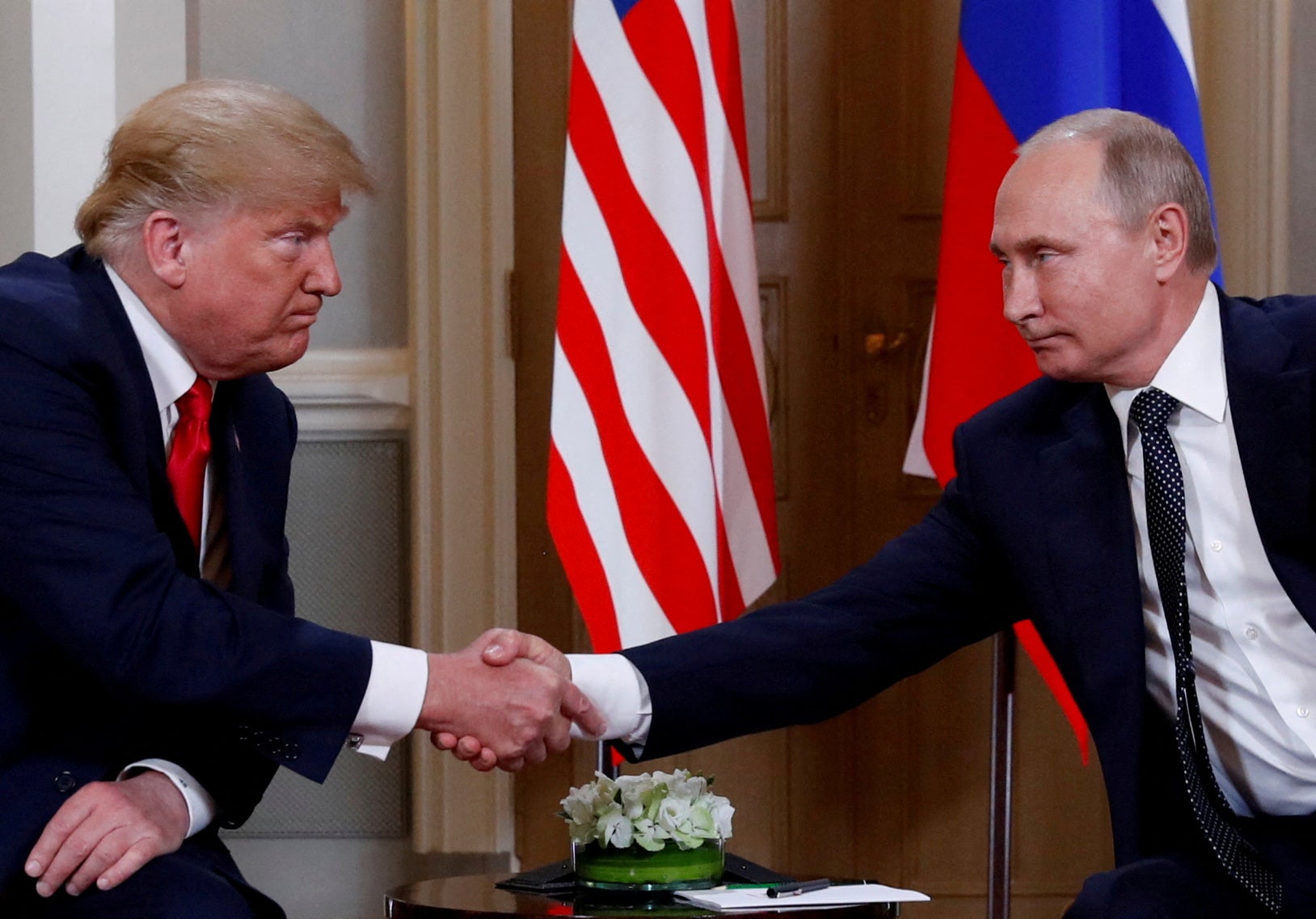 Donald Trump and Vladimir Putin pictured during an official meeting in Helsinki in 2018