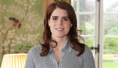 Princess Eugenie of York smiles as she attends a reception and panel discussion on the fashion industry's commitment to sustainability