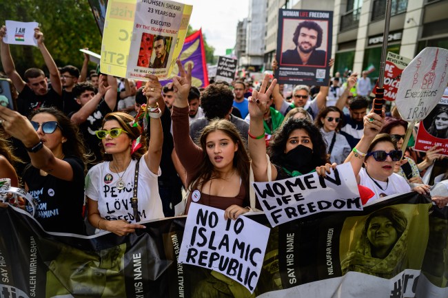 LONDON, ENGLAND - SEPTEMBER 16: Protesters chant and hold banners as they take part in a march against the Iranian Islamic Regime on September 16, 2023 in London, England. Mahsa Amini, a 22-year-old Iranian woman died unexpectedly on September 16, 2022 in police custody after violating the Iranian Islamic Regime's imposed dress code for women, sparking mass protests and ensuing arrests and executions. Some 500 people were killed, including 70 children and thousands incarcerated during the protests that swept the nation. (Photo by Leon Neal/Getty Images)