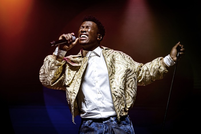 Claude singing into a microphone