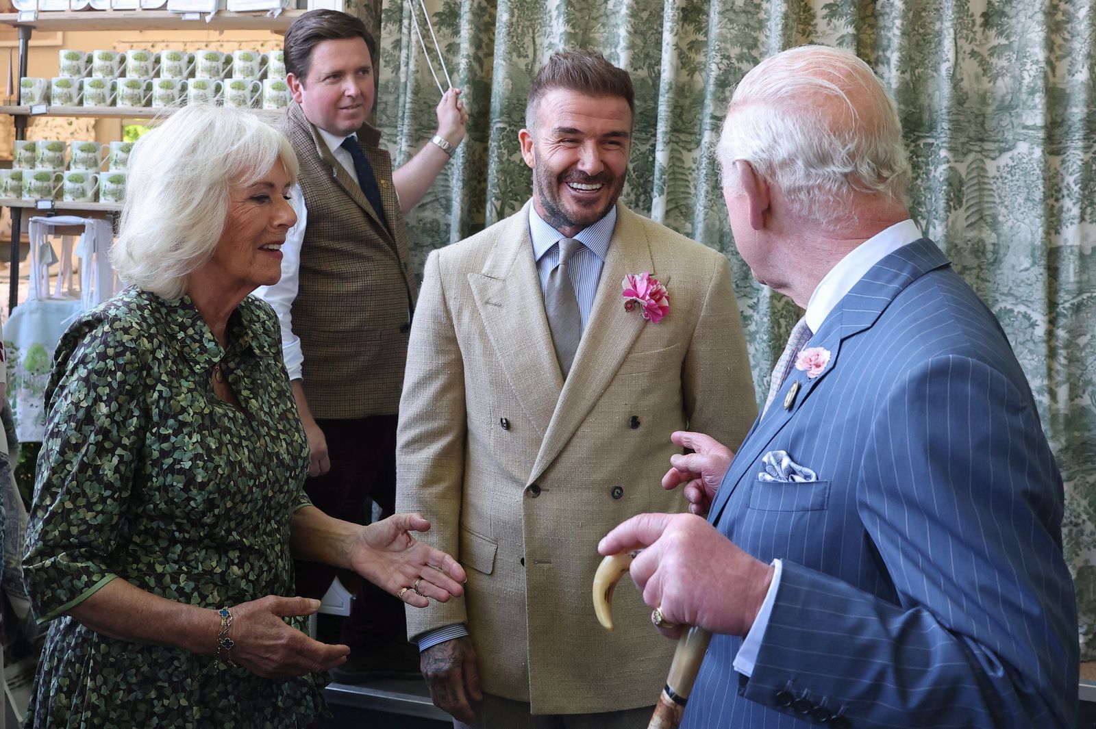 Image may contain David Beckham Oriol Junqueras Clothing Coat Adult Person Accessories Formal Wear Tie and Blazer