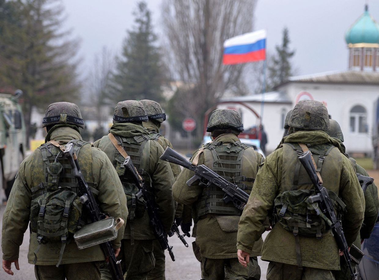 Russian soldiers in the area surrounding a Ukrainian military unit outside Simferopol, Crimea, Ukraine on March 20, 2014. 