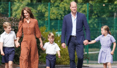 Prince William and Kate Middleton hold hands with their three kids