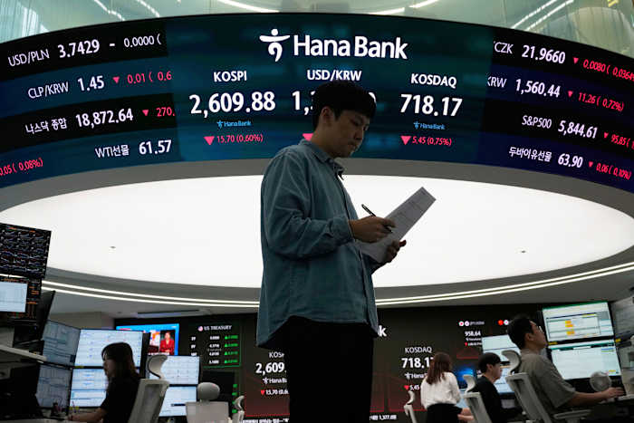 Asian shares slip as worries about U.S. debt send Wall St tumbling