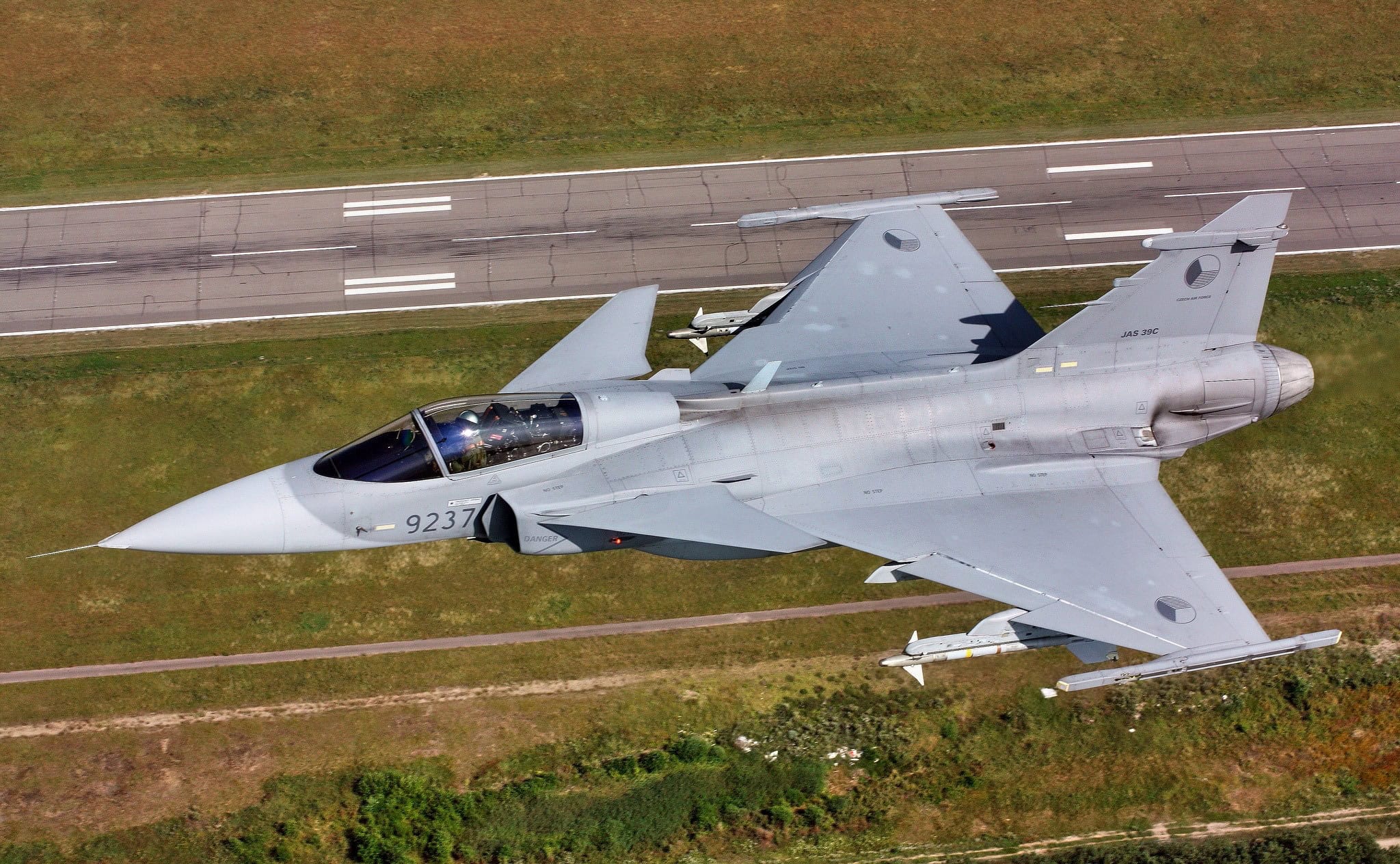 JAS 39 Gripen over a Road