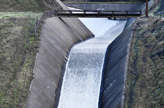 Water flows over the spillway at the Nicasio Reservoir in Nicasio, Calif., on Wednesday, Dec. 18, 2024. (Alan Dep/Marin Independent Journal)