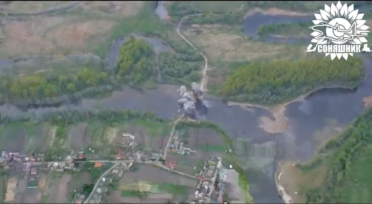 Ukrainian drone perspective of the bombing of the bridge with Russian soldiers at Tyotkino, Kursk Oblast a few days ago