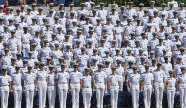 U.S. Naval Academy midshipmen stand during the academy's graduation and commissioning ceremony at t...