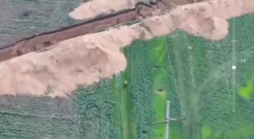 A russian soldier on a motorcycle tried a high-speed jump over an anti-tank ditch but faceplanted into it [May 2025]