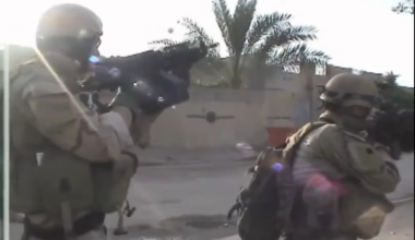 SEAL Team 3 providing suppressive fire during a patrol in the streets of Ramadi, Iraq. 2006
