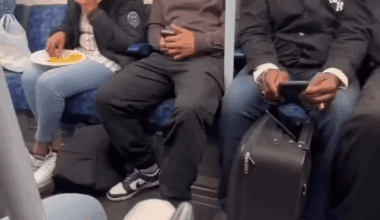 Eating curry rice and talking loud over phone inside London Tube