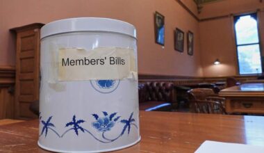 In New Zealand's Parliament, a battered cookie tin decides which new laws get debated