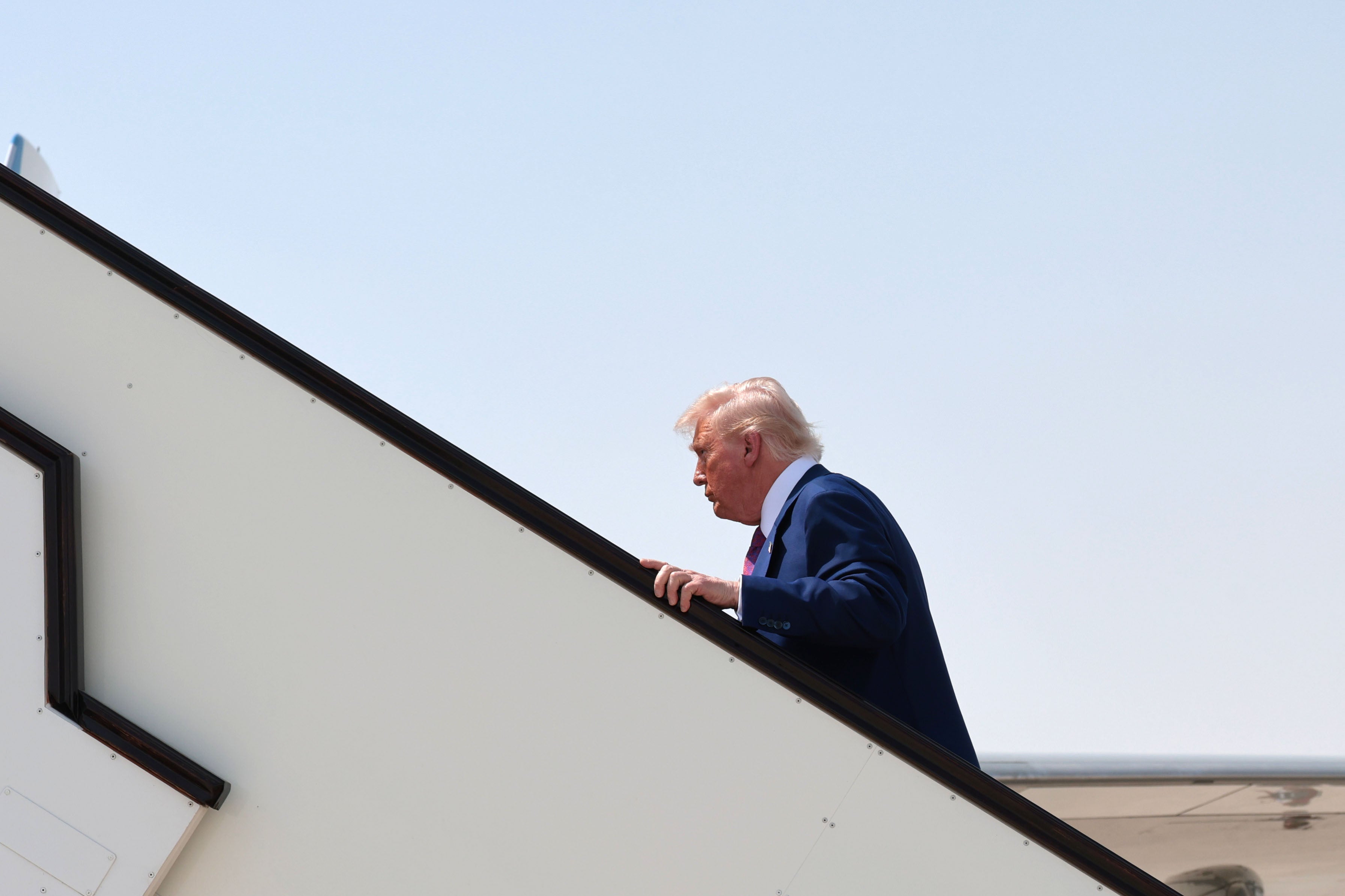 Donald Trump as he leaves Qatar for the UAE