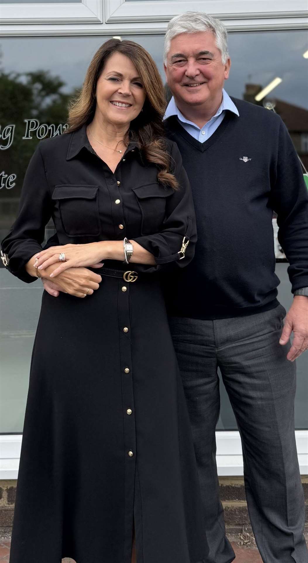 Robert and Gill in front of their new office