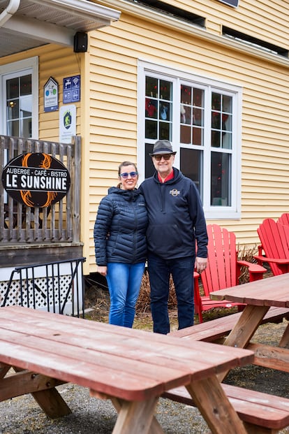Karine Cantin and Jean Des Rosiers, members of the Haskell Library, outside their bakery and hostel in Stanstead.