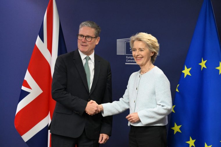 Britain's Prime Minister Keir Starmer shakes hand with President of the European Commission Ursula von der Leyen at the European Commission headquarters in Brussels on October 2, 2024. Keir Starmer arrived in Brussels on October 2 on his first visit as British prime minister, looking to build on a promised "reset" of relations with the European Union after the rancour of Brexit. (Photo by Nicolas TUCAT / AFP) (Photo by NICOLAS TUCAT/AFP via Getty Images)