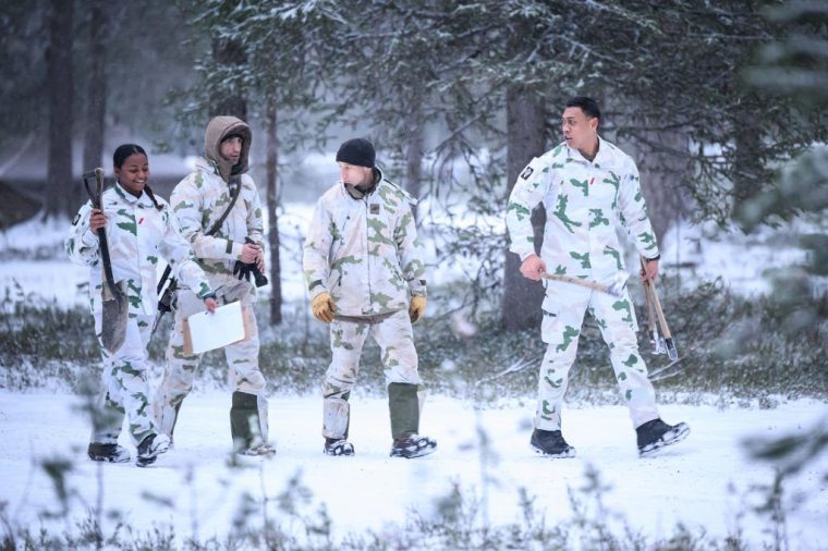 HEINUJARVI, FINLAND - NOVEMBER 19: Soldiers walk through the camp, as members of the Finnish arctic expert Jaeger Brigade train British, Swiss and french troops in cold-weather logistics on November 19, 2024 near Heinujarvi, Finland. The exercises include service members from 28 Allied and partner nations, and are taking place between November 4-24, across locations in Finland, Estonia, Germany, Poland, and Romania. (Photo by Leon Neal/Getty Images)