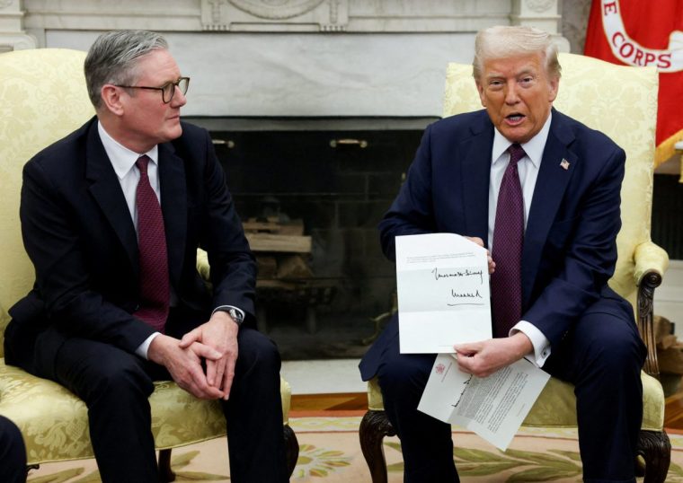 FILE PHOTO: FILE PHOTO: U.S. President Donald Trump holds a letter from Britain's King Charles as he meets with British Prime Minister Keir Starmer in the Oval Office at the White House in Washington, D.C., U.S., February 27, 2025. REUTERS/Kevin Lamarque/File Photo/File Photo