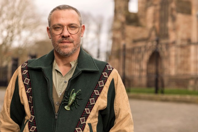 Will Young wearing a jacket with an insect brooch