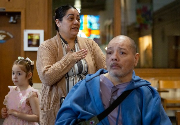 Siblings Elva and Vincent Zamora talk before Mass on May 11, 2025, at Christ Our Savior Catholic Church in South Holland. Like Pope Leo XIV, the Zamora family attended St. Mary of the Assumption Parish in Riverdale which later consolidated with St. Jude to form Christ Our Savior. (Brian Cassella/Chicago Tribune)