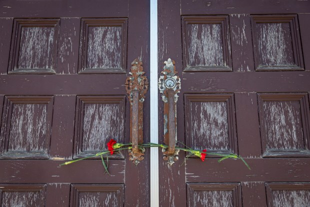 Roses are left in the door for new Pope Leo...