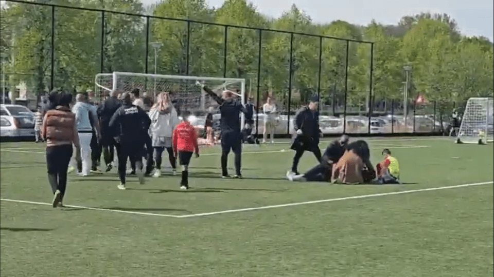 Parents ran onto the pitch as children fled the scene