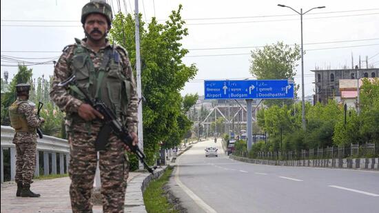 Security personnel stand guard on a road towards the airport, in light of the ongoing military conflict between India and Pakistan, in Srinagar, Jammu and Kashmir. (PTI Photo/S Irfan) (PTI05_10_2025_000173B) (PTI)