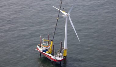 A vessel works alongside a wind turbine at the Shell NoordzeeWind offshore wind farm