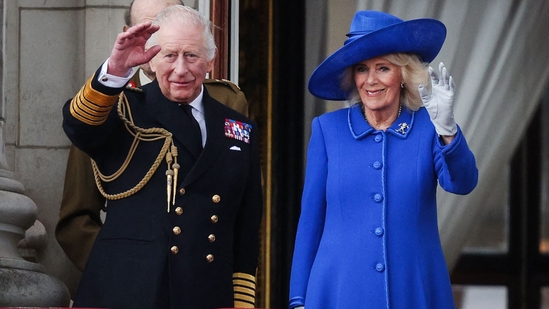 Britain's King Charles III and Britain's Queen Camilla wave to crowds, on the balcony of Buckingham Palace after attending the armed forces procession on May 5, 2025 to celebrate the 80th anniversary of VE Day also known as Victory in Europe Day, marking the end of the Second World War in Europe.(AFP)