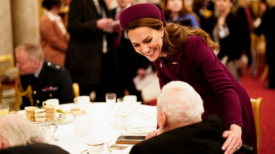 Britain's Catherine, Princess of Wales (rear) speaks with a Second World War veteran during a tea party at Buckingham Palace on May 5, 2025 to celebrate the 80th anniversary of VE Day also known as Victory in Europe Day, marking the end of the Second World War in Europe. (AFP)