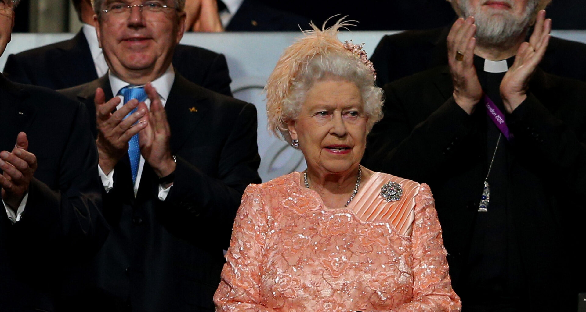 Queen Elizabeth wearing a peach dress at the 2012 Olympics